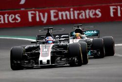 Romain Grosjean, Haas F1 Team VF-17 and Lewis Hamilton, Mercedes-Benz F1 W08  battle