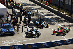 Sébastien Buemi, Renault e.Dams, and Daniel Abt, ABT Schaeffler Audi Sport, leave the pits