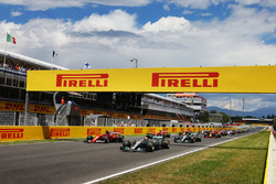 Lewis Hamilton, Mercedes AMG F1 W08, Sebastian Vettel, Ferrari SF70H, lead at the start of the race