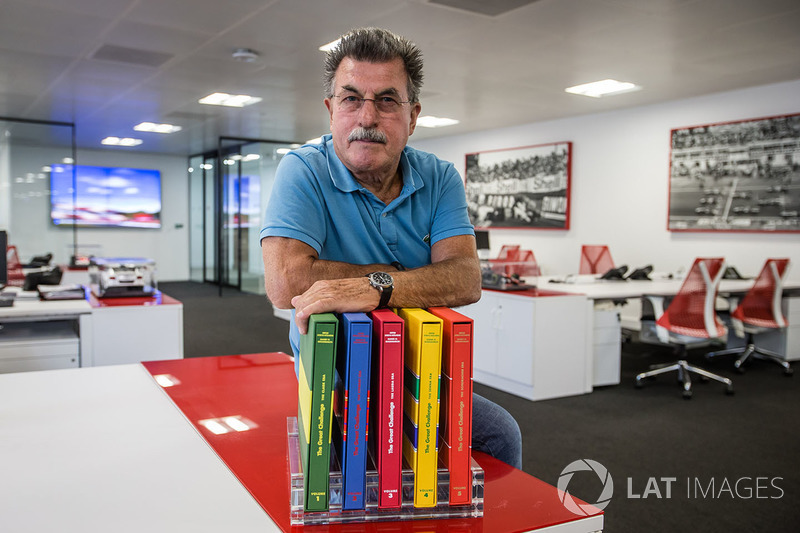 Rainer W. Schlegelmilch poses in the Motorsport Network office