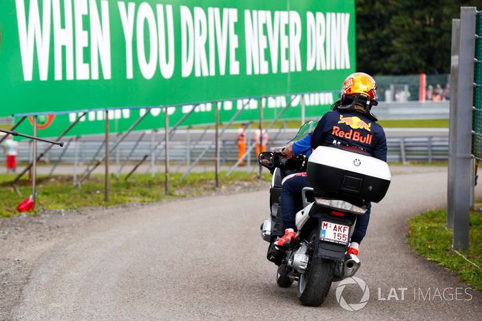 Max Verstappen, Red Bull Racing on a motorcycle after retiring