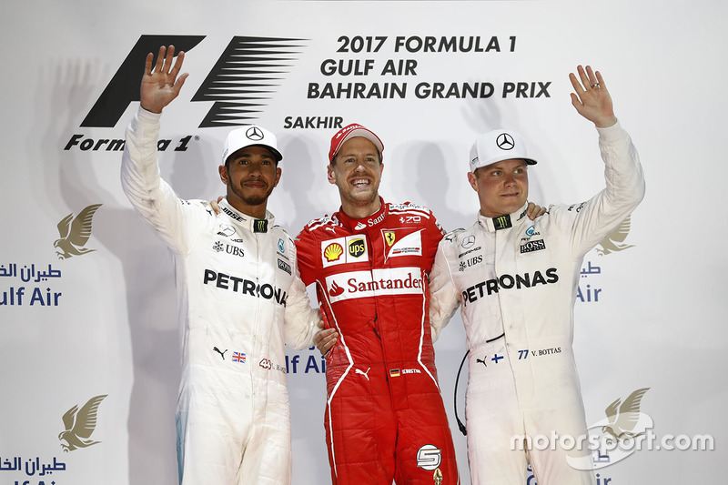 Podium: winner Sebastian Vettel, Ferrari, second place Lewis Hamilton, Mercedes AMG F1, third place Valtteri Bottas, Mercedes AMG F1