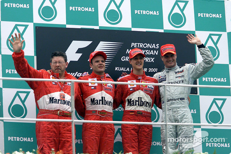 Ross Brawn, Rubens Barrichello, Michael Schumacher y David Coulthard en el podio