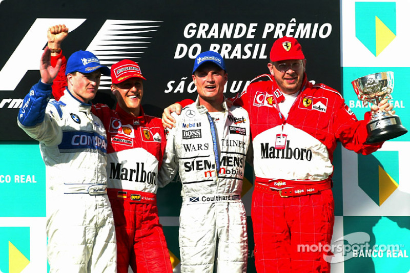 Podio: il vincitore Michael Schumacher con Ralf Schumacher, David Coulthard e Ross Brawn