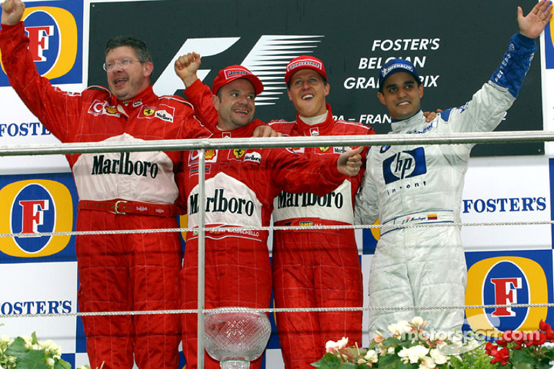 The podium: race winner Michael Schumacher with Ross Brawn, Rubens Barrichello and Juan Pablo Montoy