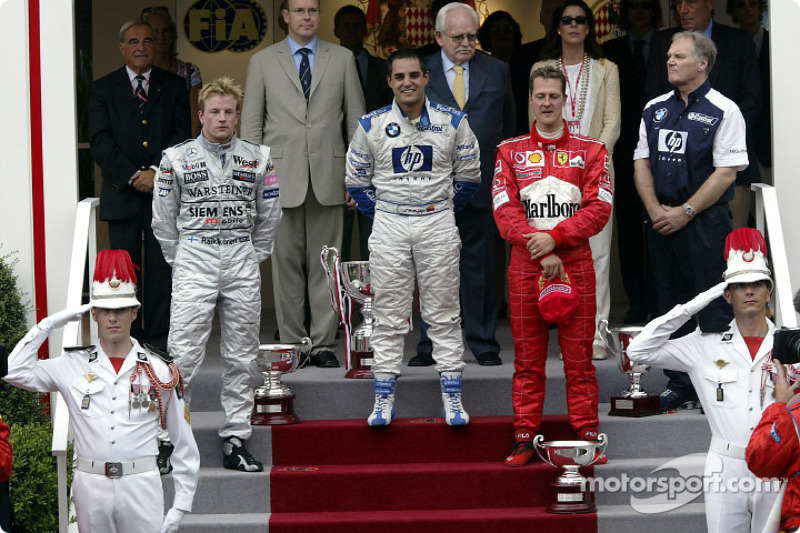 Het podium: race winnaar Juan Pablo Montoya met Kimi Raikkonen en Michael Schumacher