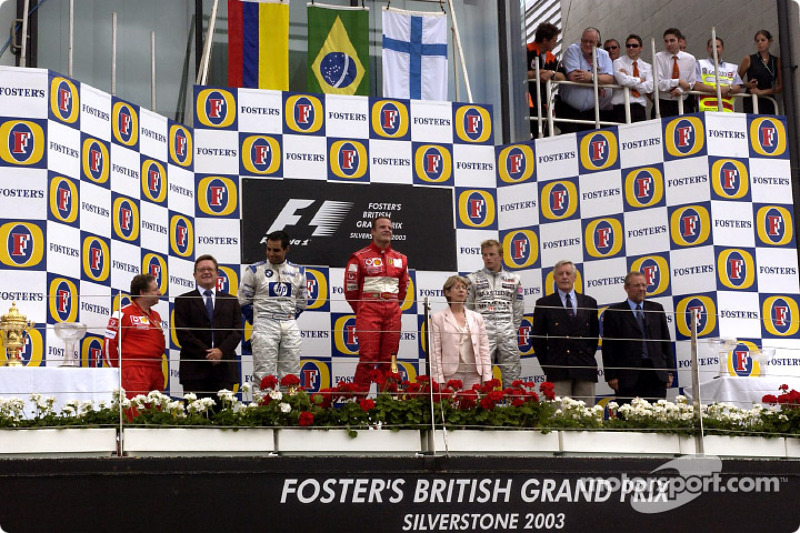 The podium: race winner Rubens Barrichello with Juan Pablo Montoya and Kimi Raikkonen