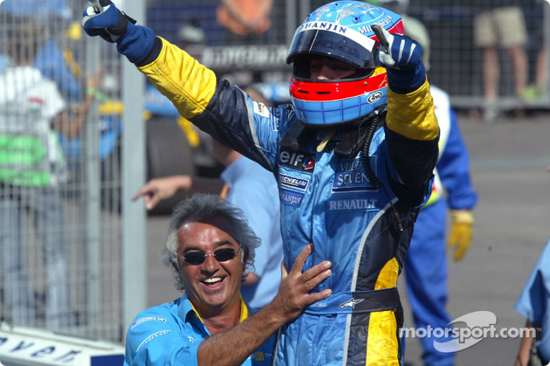 Race winner Fernando Alonso celebrates with Flavio Briatore