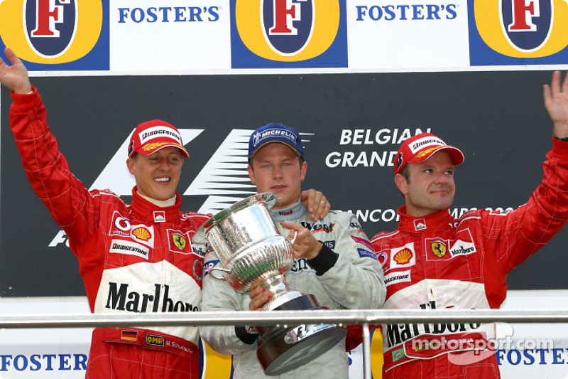 Podium: race winner Kimi Raikkonen with Michael Schumacher and Rubens Barrichello