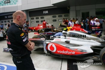 Red Bull’s Adrian Newey examining the competition