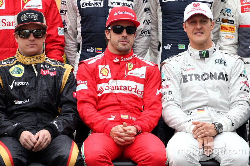Kimi Raikkonen, Lotus F1 Team, Fernando Alonso, Scuderia Ferrari, e Michael Schumacher, Mercedes AMG F1