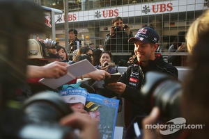 Sebastian Vettel, Red Bull Racing signs autographs for the fans