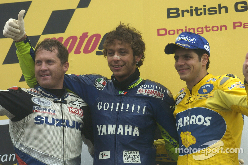 Podium: race winner Valentino Rossi with Kenny Roberts and Alex Barros