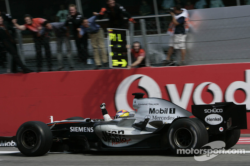 Race winner Juan Pablo Montoya celebrates