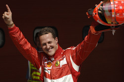 Pole winner Michael Schumacher celebrates