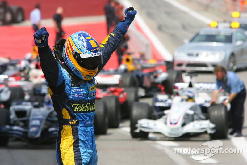 Race winner Fernando Alonso celebrates