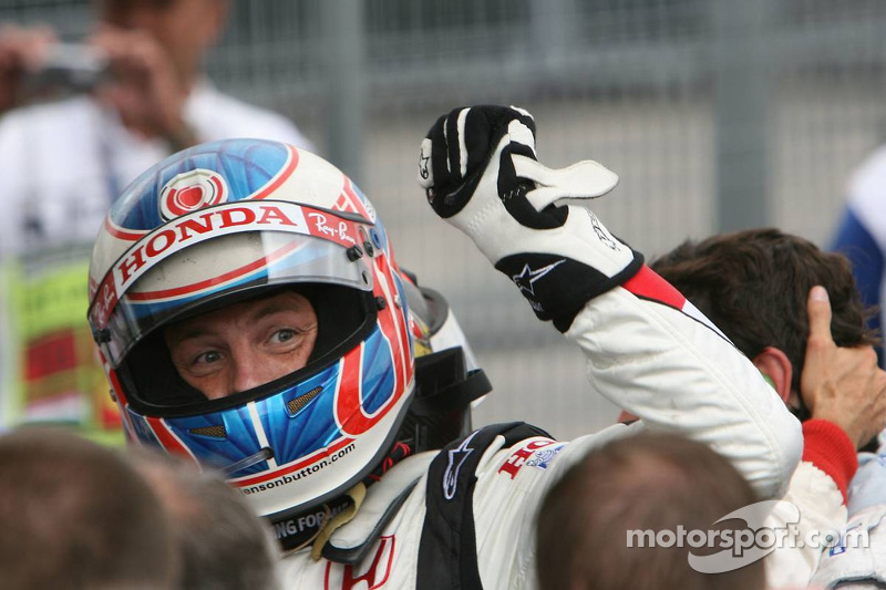 Race winner Jenson Button celebrates