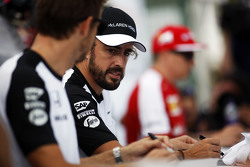 Fernando Alonso, McLaren and Jenson Button, McLaren sign autographs for the fans