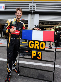 Romain Grosjean, de Lotus F1 Team celebra su tercera posición con el equipo