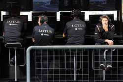 Paul Seaby, Lotus F1 Team Team Manager, Matthew Carter, Lotus F1 Team CEO, Federico Gastaldi, Lotus F1 Team Deputy Team Principal, and Romain Grosjean, Lotus F1 Team on the pit gantry