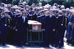 Emerson Fittipaldi, Jackie Stewart, Johnny Herbert, Derek Warwick, Gerhard Berger, Rubens Barrichello, Thierry Boutsen, Alain Prost and Damon Hill help lead the casket of Ayrton Senna during the funeral procession