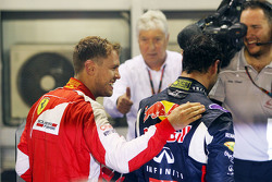 Sebastian Vettel, Ferrari, festeggia la vittoria nel parco chiuso con il secondo classificato Daniel