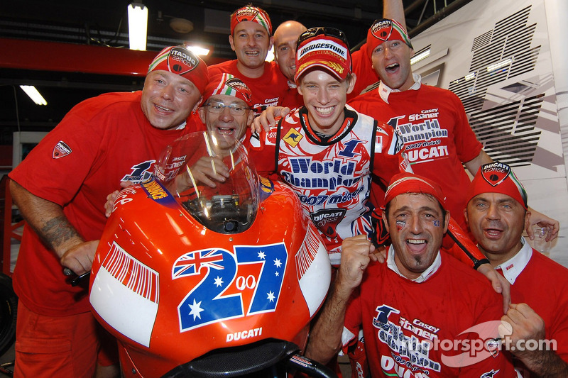 2007 MotoGP champion Casey Stoner celebrates with his team