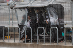 The Mercedes AMG F1 pit gantry during heavy rain in the second practice session