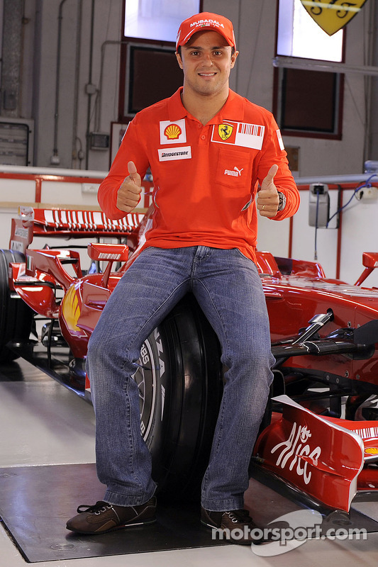 Felipe Massa poses with the new Ferrari F2008