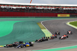 Jenson Button, McLaren MP4-30 and Marcus Ericsson, Sauber C34 at the start of the race