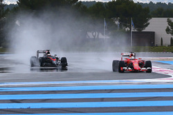 Sebastian Vettel, Ferrari e Stoffel Vandoorne, Mclaren
