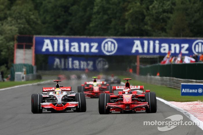 Kimi Raikkonen, Scuderia Ferrari overtakes Lewis Hamilton, McLaren Mercedes